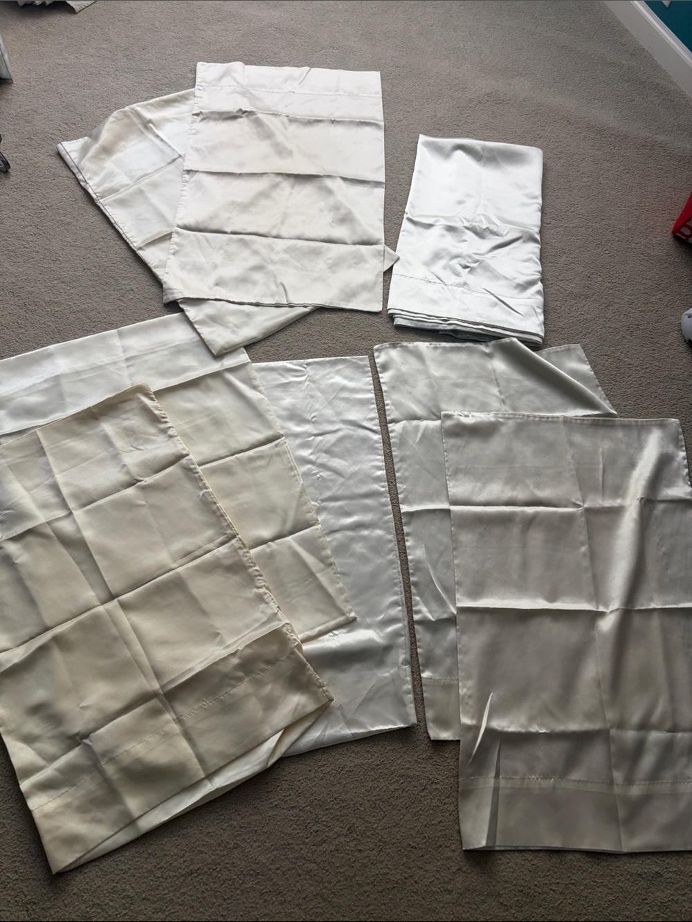 White/Cream Satin pillow cases and a full size flat sheet.
